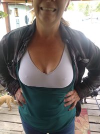 Showing off her new comfy bra. That fucker really keeps the girls under con...
