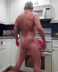 Naked in the kitchen.