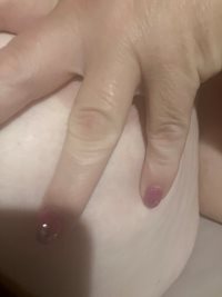 Wife trying to hide her nipple from photo