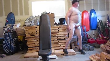 Naked walk in the open garage.