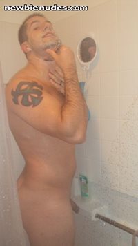 Shaving in the shower.
