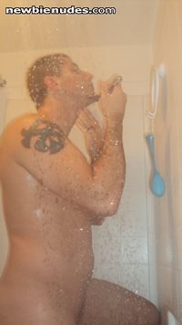 Shaving in the shower.